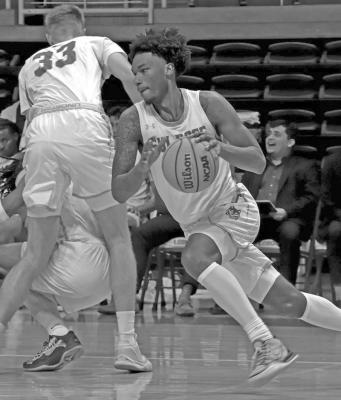 Sul Ross’ Ethan Yancy controls the ball amidst fellow players on Saturday at the Gallego Center during the Lobos’ loss to Western New Mexico. Photo courtesy of Briana Martin