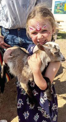 As part of Saturday’s Earth Day celebration in Alpine, Bristol Hendryx took advantage of the opportunity to spend time with some baby goats that were on hand during the event. Courtesy photo