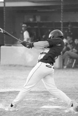 Peyton Tays takes a swing at a ball during Alpine’s last regular season game against Presidio. Photo courtesy of Annika Canaba-AMC Phototgraphy
