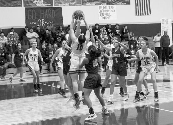 Alpine Lady Buck Karolina Castillo struggles with a Kermit player for control of the ball at Tuesday’s game against the Yellow Jackets. Photo by Joh Covington