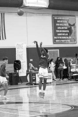 Daedrick Hardwick goes for a jump shot during warm-ups at a recent home game. Photo by Joh Covington