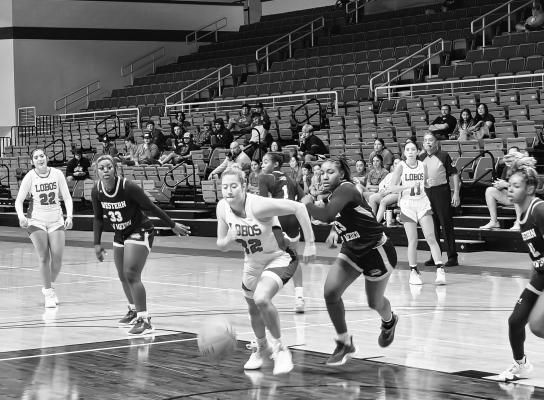 Marley Rokas chases down a loose ball during an early season game against Western New Mexico. Photo by Kara Gerber