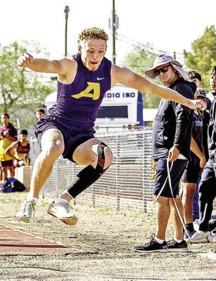 Senior long jumper Logan Smith has a look of determination on his face as he competes at last Thursday’s District track meet. Photo by Kara Gerbert