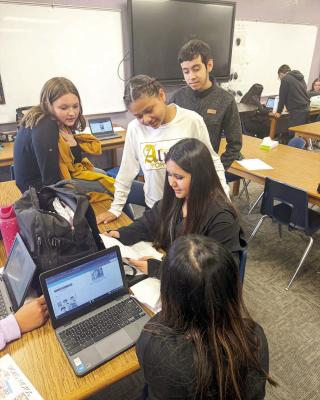 These 8th-grade ELA students at Alpine Middle School recently sent business letters to different businesses and received a great response. Brooks Shoes and HTeaO in Odessa responded with coupons for their stores. Courtesy photo