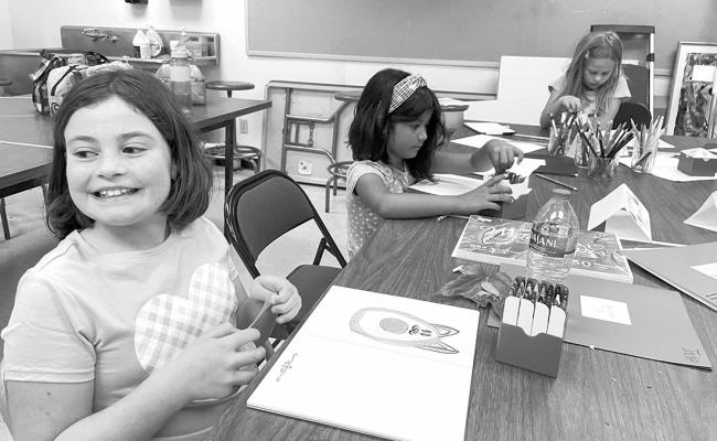 Jane Scott, Victoria Grajeda, and Rosy Doucleff work on art projects during the Art and Spanish day camp being held at Sul Ross. Courtesy photo