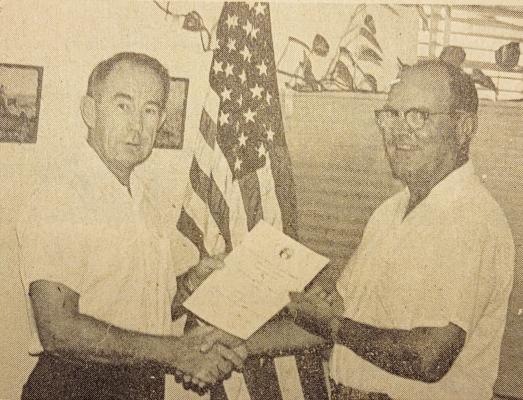 July 15, 1971 — Hugh Calvert presented William J. Burcham with a 20 -year pin and commendation for services rendered to the International Boundary and Water Commission. Burcham began his career with the IBWC here in Alpine.