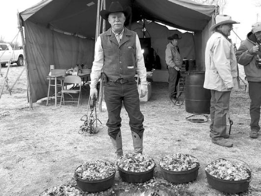 Robert Leese watches over several Dutch ovens full of biscuits he’s cooking at the Chuck Wagon breakfast held at Poet’s Grove. The Chuck Wagon breakfast is an annual event held during the Lone Star Cowboy Poetry Gathering. Photo by Kara Gerbert