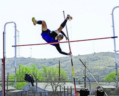 Alpine’s John Mendoza pushes himself over the bar during the pole vault competition at last week’s District track meet. Photo by Kara Gerbert