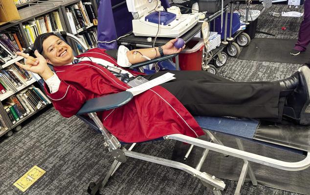 Student Council mentor Chris Valenzuela takes time on Monday to give blood as part of a blood drive sponsored by the Alpine High School Student Council. Courtesy photo