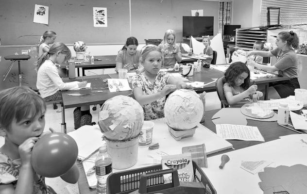 Young and aspiring thespians work on creating their masks during Sul Ross’ summer youth theatre camp. The students are separated into two groups during the day with one group working on the art portion while the other works on performance dynamics and then they switch places after a short break. Photo by Kara Gerbert
