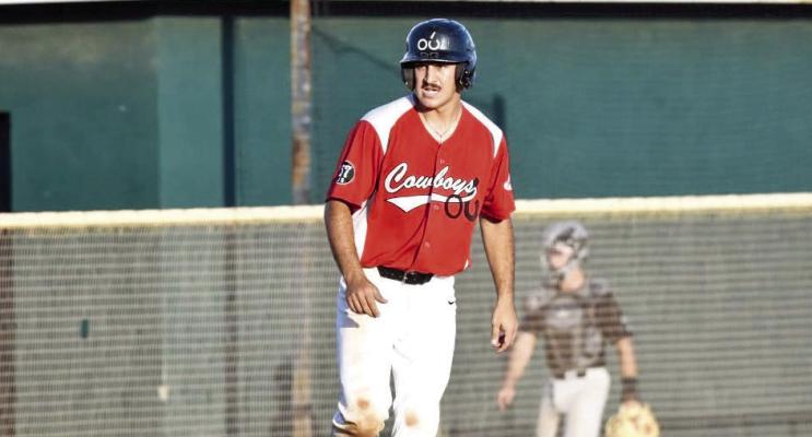 Trevor Durr looks towards home plate as he awaits a fellow team member to bring him home from third. Julie Myers