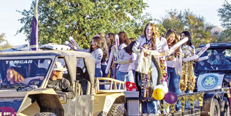 AHS volleyball teams show their team spirit during last week’s homecoming parade as they’re escorted by their coach, Linda Morris, and her husband, school board member Jimmy Morris. Photo by Kara Gerbert