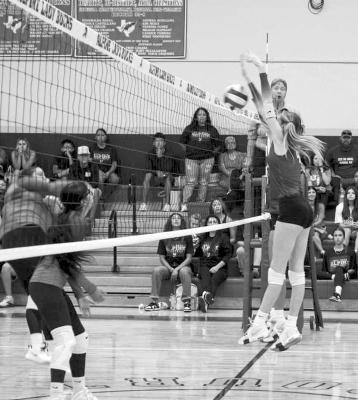 Peyton Kincaid attempts a block on a spike from Van Horn during Tuesday’s home opener at Alpine High School. Photo courtesy of Sonia Ortega Ybarra