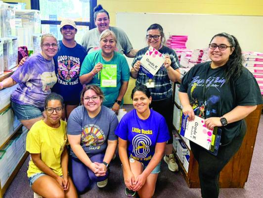 Alpine Elementary School educators spent time out of their summer this month unboxing and sorting six pallets of instructional materials for the 2025-2026 school year. Courtesy photo