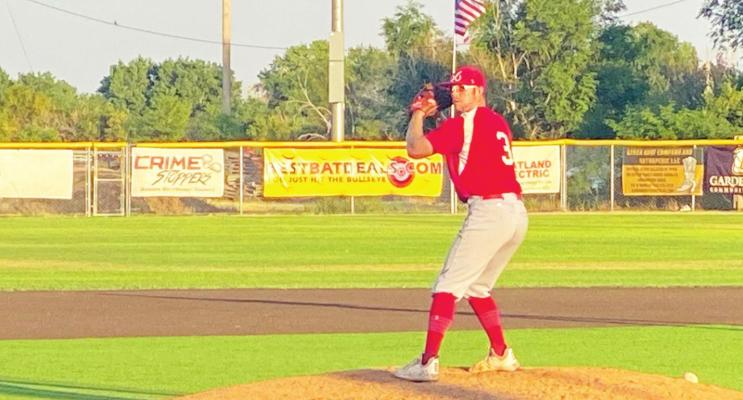 Alpine o6 Cowboys pitcher Colton Whitehouse takes the mound in Garden City. Courtesy photo