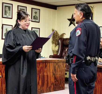 Lt. Kirk Caughman, a 25-year veteran of the Alpine Police Department, is sworn in by Judge Elizabeth Lewis as the new Chief of Police. Caughman