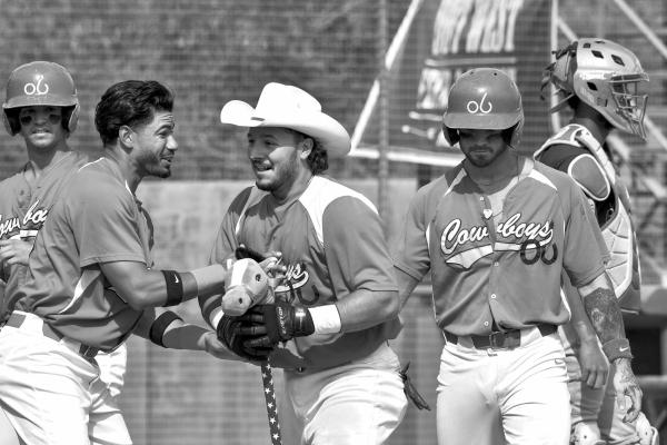 Alpine Cowboys catcher Jake Sisto celebrates his home run against the Austin Weirdos July 29 at Kokernot Field with a pair of props, the team’s cowboy hat and hobby horse. Photo by Julie Myers