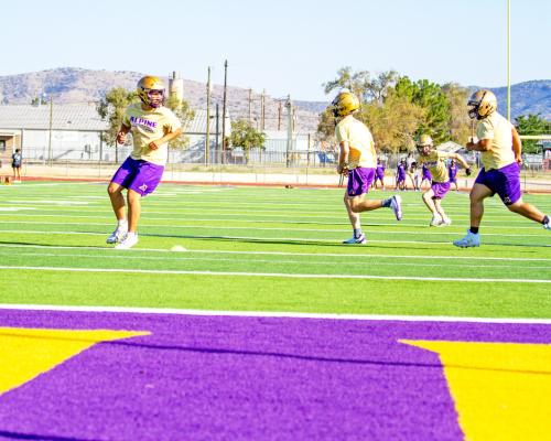 The Alpine Fightin’ Bucks run practice drills prior to their win over Fabens. Photo by Kara Gerbert