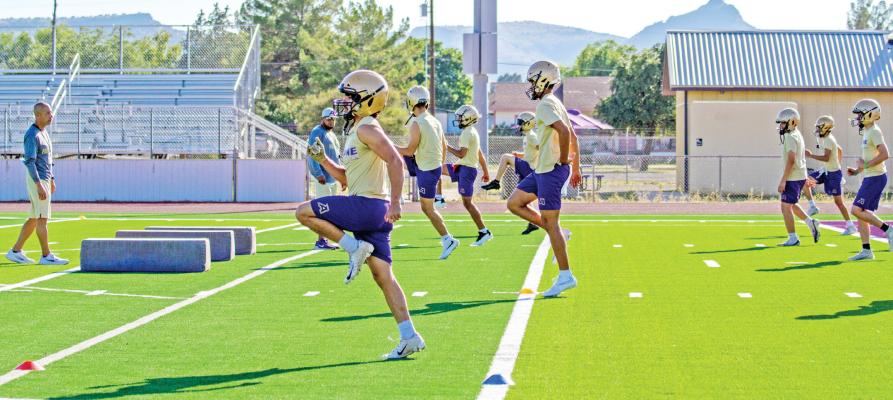 The Fightin’ Bucks have been hard at work during evening practices under the watchful eyes of Head Coach Jerry Dominguez and Coach Llanez. Photo by Kara Gerbert