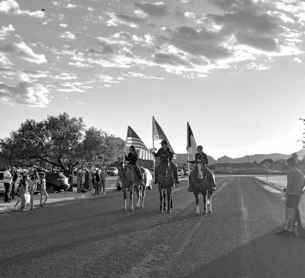 Reese Coleman, Clancy Newman, and Mia Lewis carried the flags on horseback in Wednesday night’s homecoming parade. Photo by Kara Gerbert