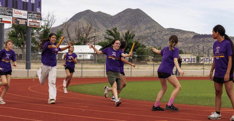 These Alpine 6th-grade girls give it everything they have in the relay race just before school ended at Buck Stadium. Courtesy photo