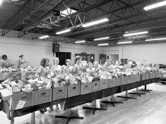 Alpine Christian School students volunteered at Grace Christian Fellowship’s food distribution center last month. Courtesy photo
