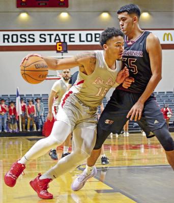 Bryce Harris attempts to get around a Schreiner University player in last night’s contest at the Gallego Center. Photo by Brylee Sweeten