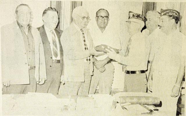 April 15, 1976 – Veterans of Foreign Wars Commander Charles E. Wade presents a flag to Brewster County Judge Sam Thomas recently. From left are Commissioners H.C. Hernandez, Billy Ward, Judge Thomas, Roberto Valadez, Wade, Commissioner Emilio Salmon, and VFW member John Joe Cadena.