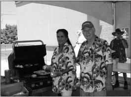 Bob and Lucy Ward man the grill at True Value this past Saturday, offering up free hot dogs to customers at their Father’s Day Grill Crazy event. Photo by Joh Covington