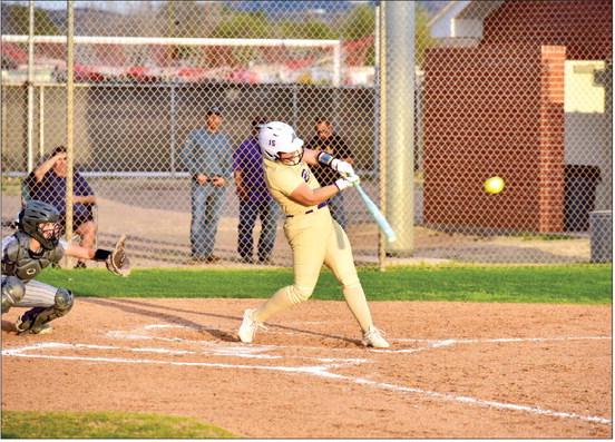 Lady Buck slugger Kody Hawkins exhibits her considerable strength at the plate in Alpine’s victory Tuesday night over the Pecos Lady Eagles. Photo by Felipe Fierro