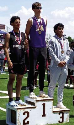 Alpine Fightin’ Buck Kelton Tarrant took the top of the podium for the triple jump competition in last weekend’s Area track and field meet in Kermit. Courtesy photo