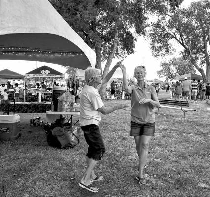 Shirley Biellier and her daughter Rhonda Cole dance outside the tent set up by Alpine’s Kiwanis Club, during the 4th of July festivities held at Kokernot Park last Tuesday. Photo by Kara Gerbert