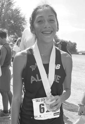 Andynne Ramirez is all smiles as she completed her cross-country race in the middle school division at Midland’s Hogan Park this past Saturday, where she placed ninth out of over 200 runners.
