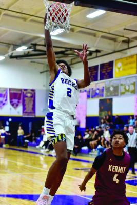 Tae Hardwick drops a ball into the net against the Bucks’ win over Kermit last Friday night. Photo by Felipe Fierro