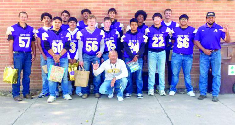 Members of the Alpine Bucks football team participated in Alpine Elementary’s Adopt a Buck program, where students and teachers created gift baskets and cards to show their support for these high school athletes. Courtesy photo
