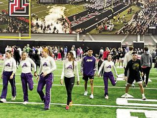 Members of the Alpine Track and Field team warm-up prior to their events this past weekend at the Sports Performance Center located on the Texas Tech campus in Lubbock. Courtesy photo