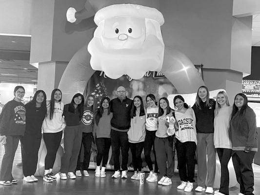 The Lady Bucks posed with their coach while in Lubbock just after Christmas. Courtesy photo