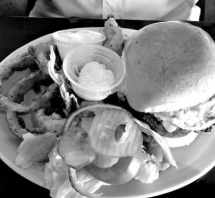 Bacon egg burger with onion rings.