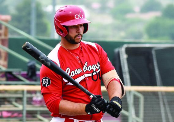 Josh Rego stands at bat during the series against the Pecos Bills. His grand slam in the final game sealed the win for the Cowboys. Photo by Julie Meyers