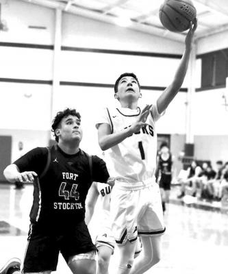 Jace Canaba goes up for the basket at the Fightin’ Bucks game against Fort Stockton on Jan. 7. Photo by Felipe Fierro