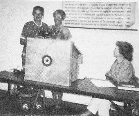 August 13, 1992 – Jean Dunlap, left, is presented with her Auxiliary award by Dorothy McMillan, while Edith Hale, right, approves.