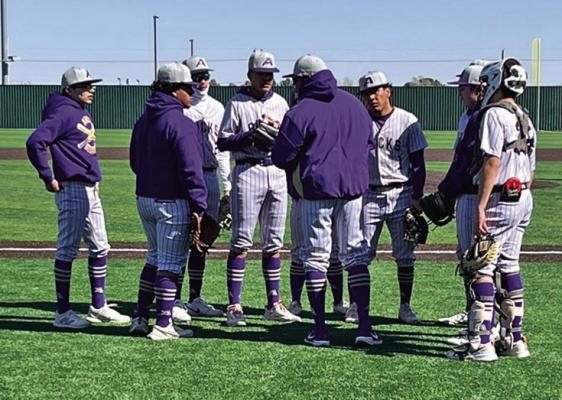 Coach Llanez gathers the team around in Fort Stockton at the Comanche Tournament to go over their game plan. Courtesy photo