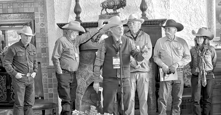 Bob Saul speaks to a crowd of cowboy poets, singer-songwriters, and fans at a press conference held in the lobby of the Holland Hotel last Thursday. He is joined by the board of the Lonestar Poetry Gathering. Photo by Kara Gerbert