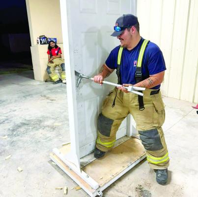 Jeremiah Pearce of the Alpine VFD took time last week to train with the Marathon VFD on breaching doors. Repetition of these skills allows emergency crews to get to trapped victims who need help when they’re behind locked doors. Photo courtesy of MVFD