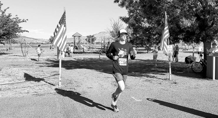 Alpine’s Hatfi eld Cason crosses the finish line on July 4 as the winner of the “Coolest 5k in Texas” held in Fort Davis. Courtesy photo