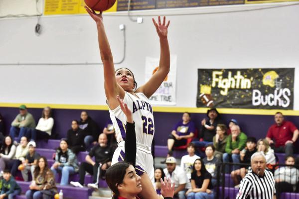 Alpine Lady Buck and senior Novah Carrasco attempts a layup during a recent game against the Tornillo Coyotes. Carrasco hit a career 1,000 points in her high school basketball career and was honored before the game during senior night. Photo by Felipe Fierro