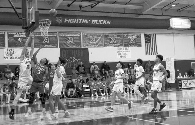 Zane Wash defends the net during the Bucks first home game against Van Horn. Photo by Joh Covington