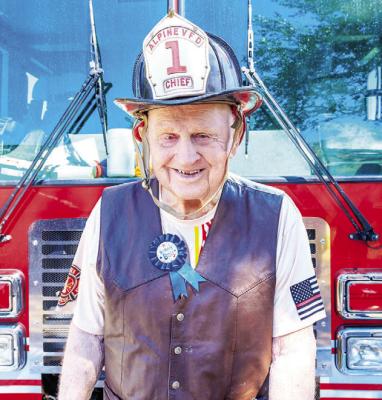 Dr. Ernest O. “Doc” Reesing stands in front of one of the current Alpine Volunteer Fire Department engines as he celebrates his 90th birthday. Courtesy photo