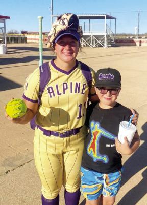 Lady Buck slugger Kody Hawkins poses with her little brother while holding her home run ball in Alpine’s win over Westbrook. Courtesy photo