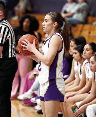 Evelyn Smith stands courtside waiting for an open teammate after an out-of-bounds ball from the Lady Bucks opponents. Photo by Felipe Fierro